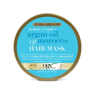blue tub of OGX Extra Strength Argan Oil of Morocco Hair Mask on a white background